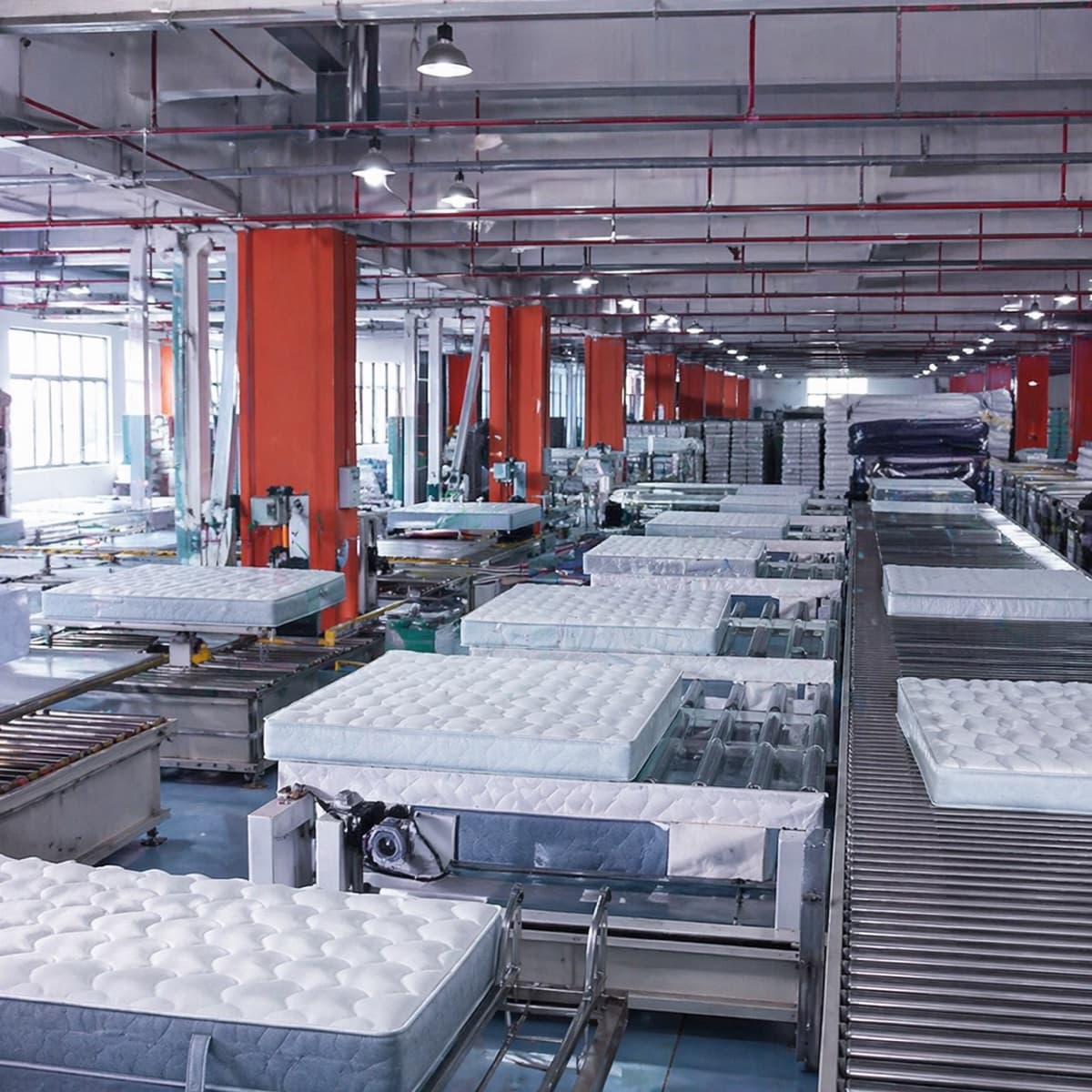 Automated mattress production line with safety railing