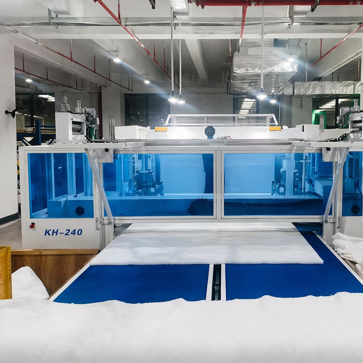 Automated fabric and mattress production machinery